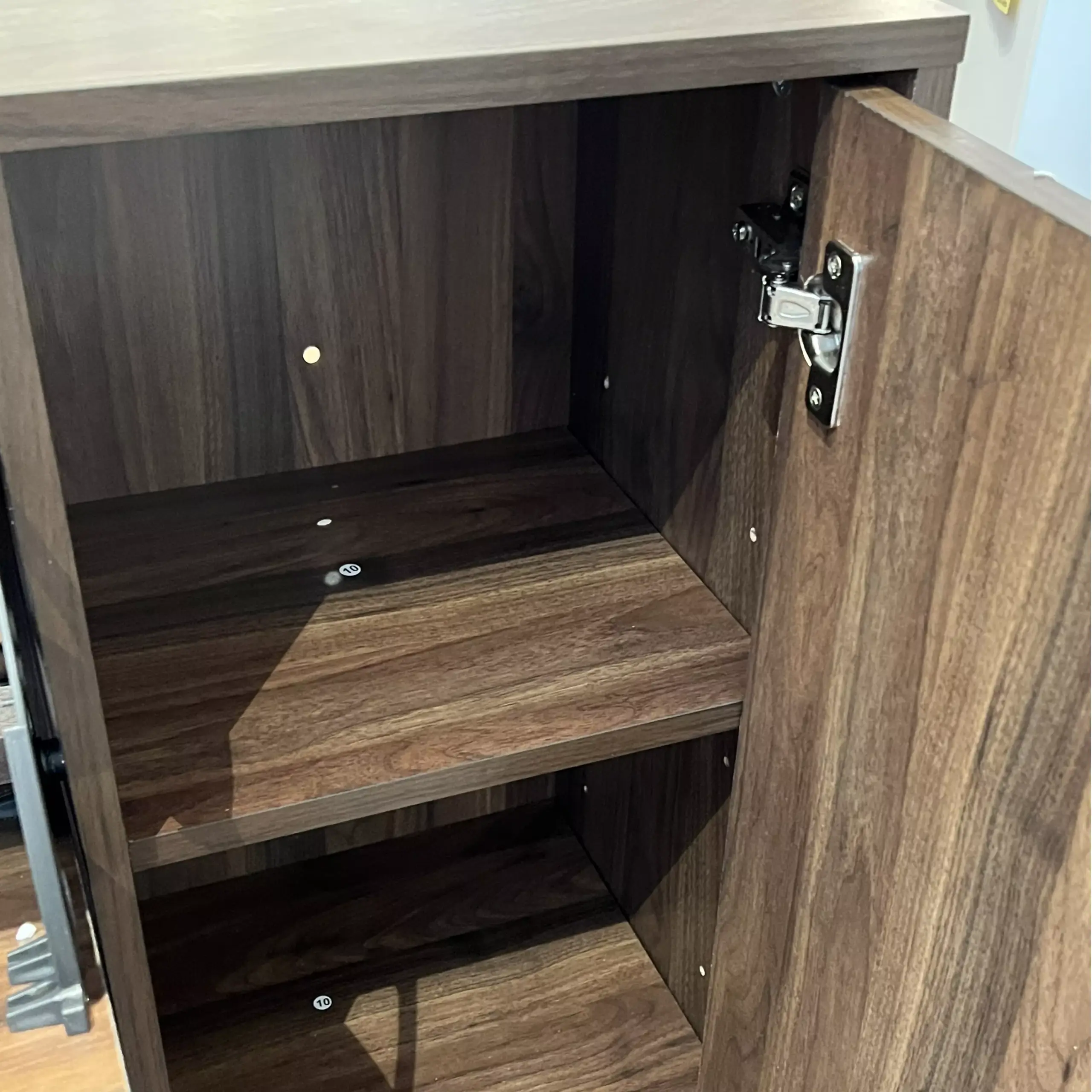 Armour Shoe Cabinet Dark Brown Open Swatch1 United Furniture